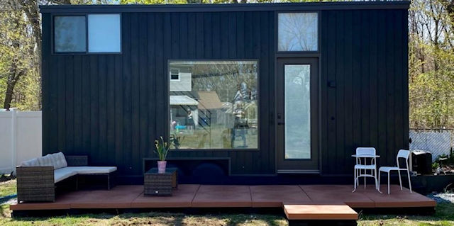 a patio deck installed by a tiny house